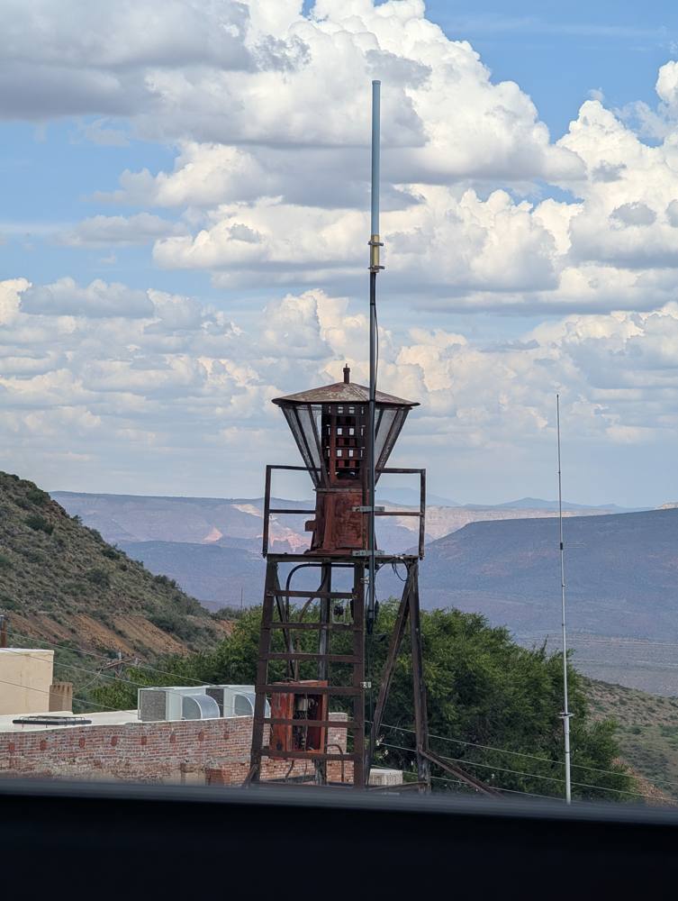 Old fire bell tower against evening clouds