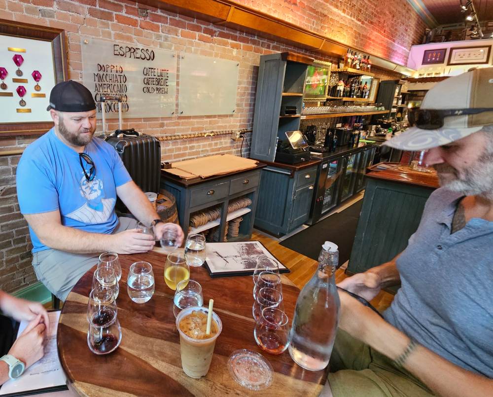 Matt and Frank with a wine flight inside Caduceus Cellars