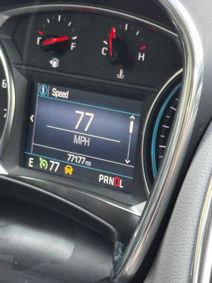 Dashboard showing 77 mph at 77,177 miles