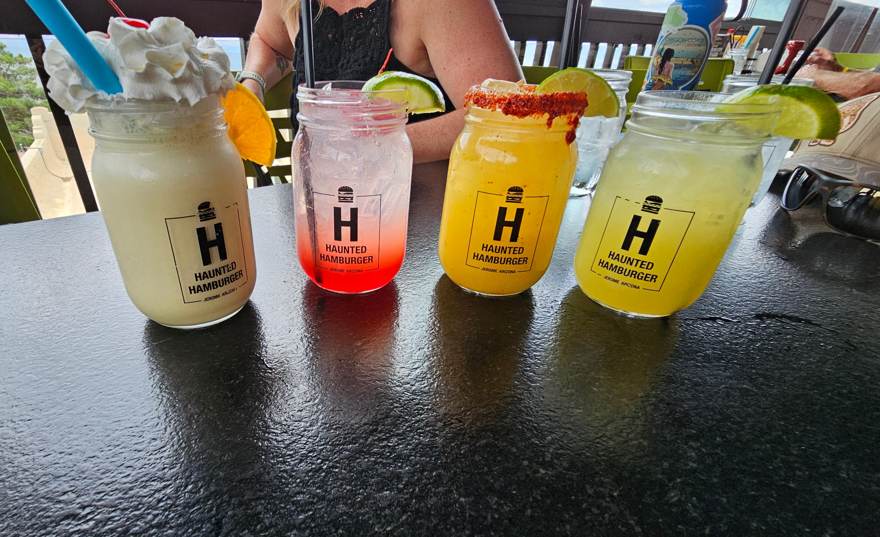 Four Haunted Hamburger cocktails in branded mason jars