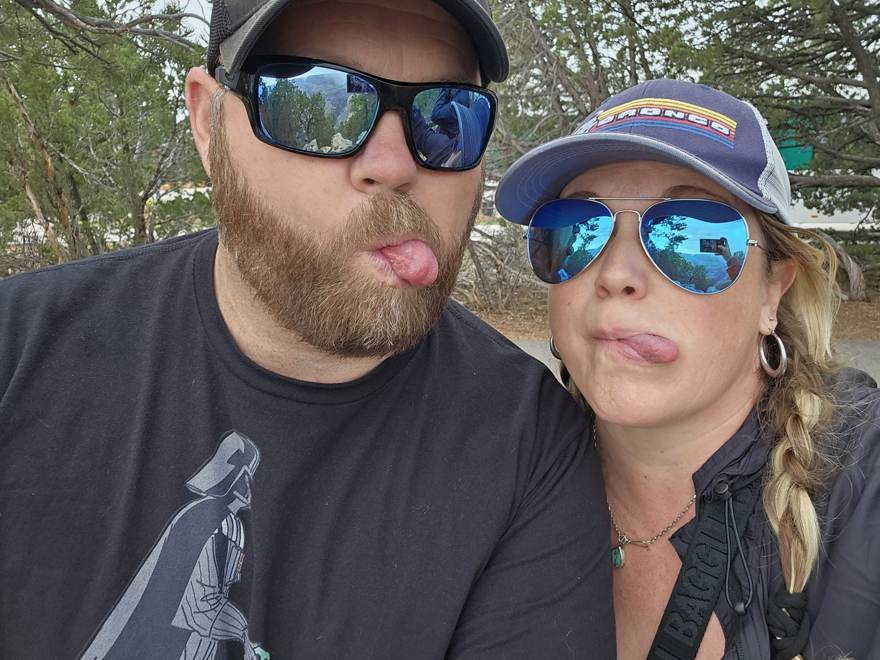 Matt and Kelsey making faces at the rim in rain gear