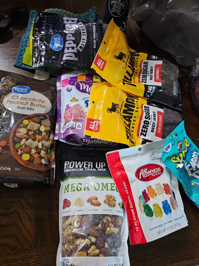 A large pile of road trip snacks
