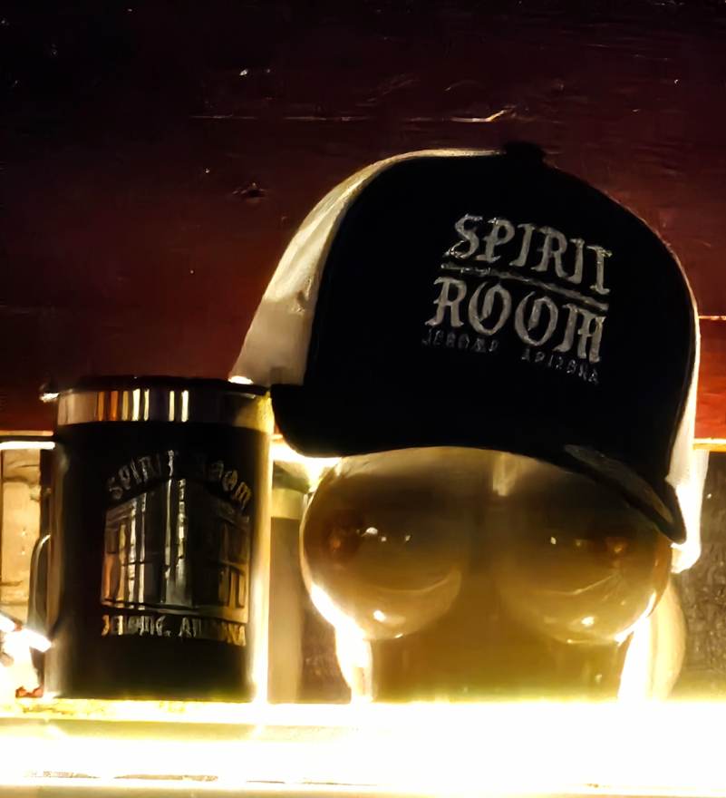 Spirit Room hat resting on the bar's anatomically bold glassware