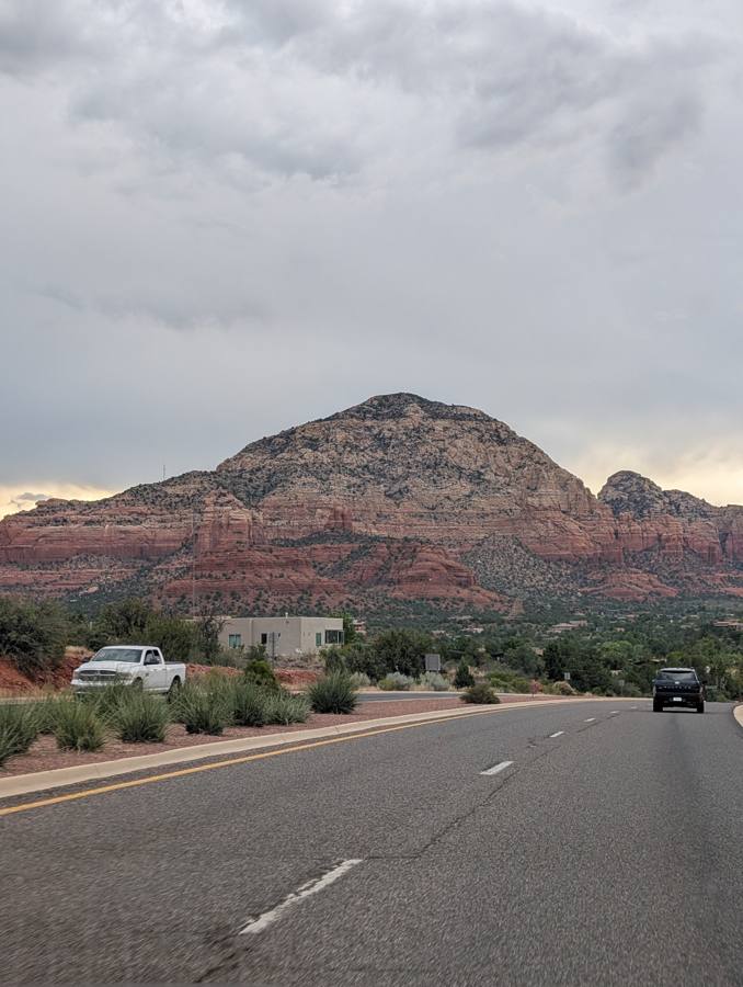 Driving toward Thunder Mountain under clouds